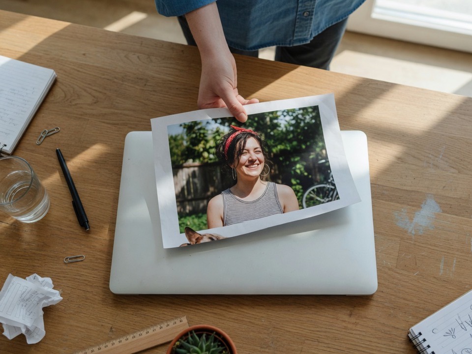Dropping a large printed photo onto a laptop before converting it from MB to KB